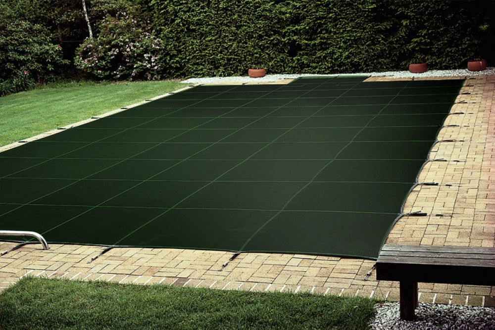 Dark Green Safety Cover On Swimming Pool