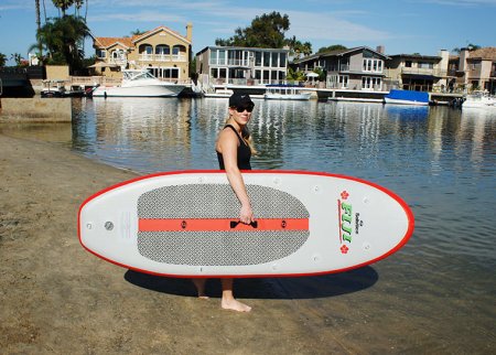 Woman Carrying Paddle Board